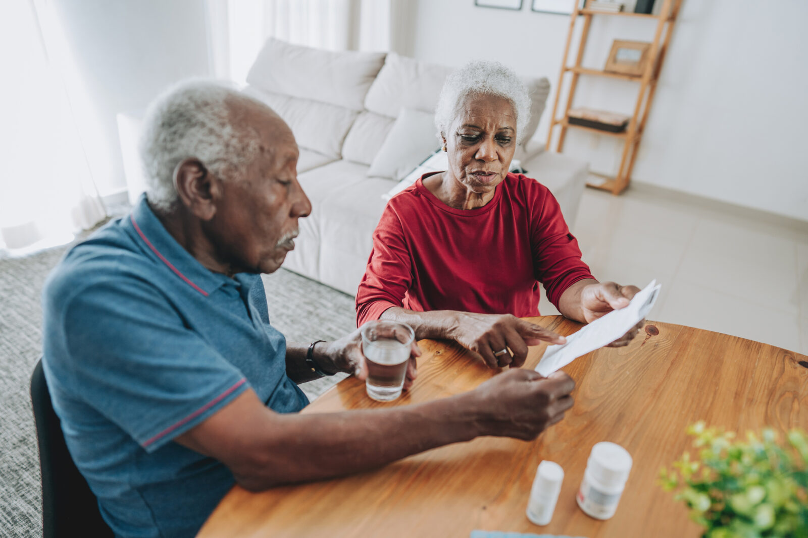 Senior couple reviewing medication at home